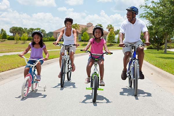 Happy family riding on their bikes